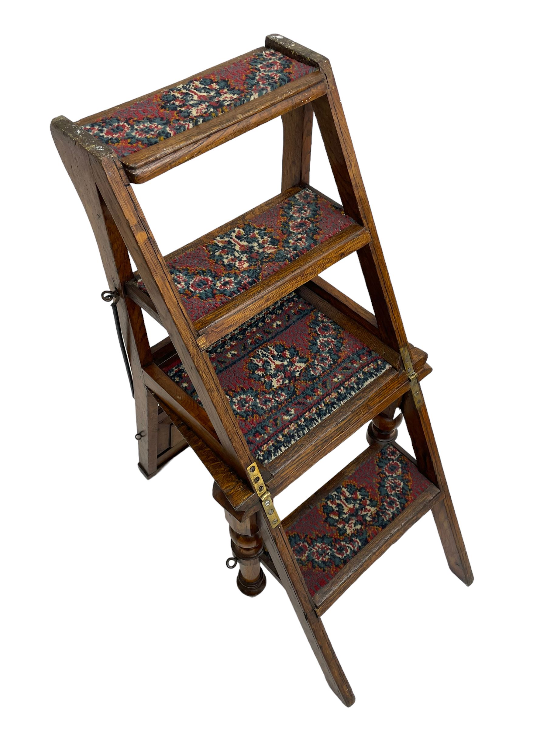 19th century oak metamorphic library steps and chair, panelled back with turned spindles over plank seat with turned front supports, the hinged seat folding forward, the steps inset with carpet treads  