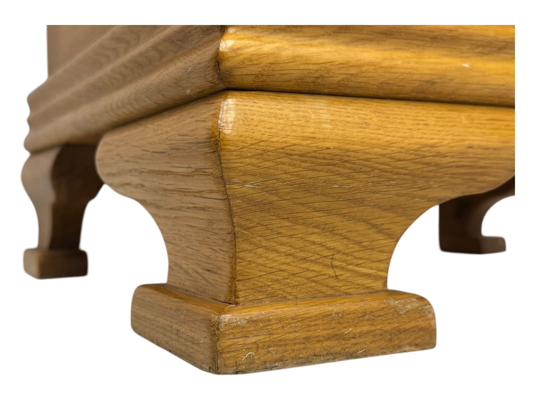 Frank Hudson - contemporary pair of light oak bedside cabinets, each with moulded rectangular top over single drawer above cupboard door with arched panel, on a moulded plinth base with bracket feet