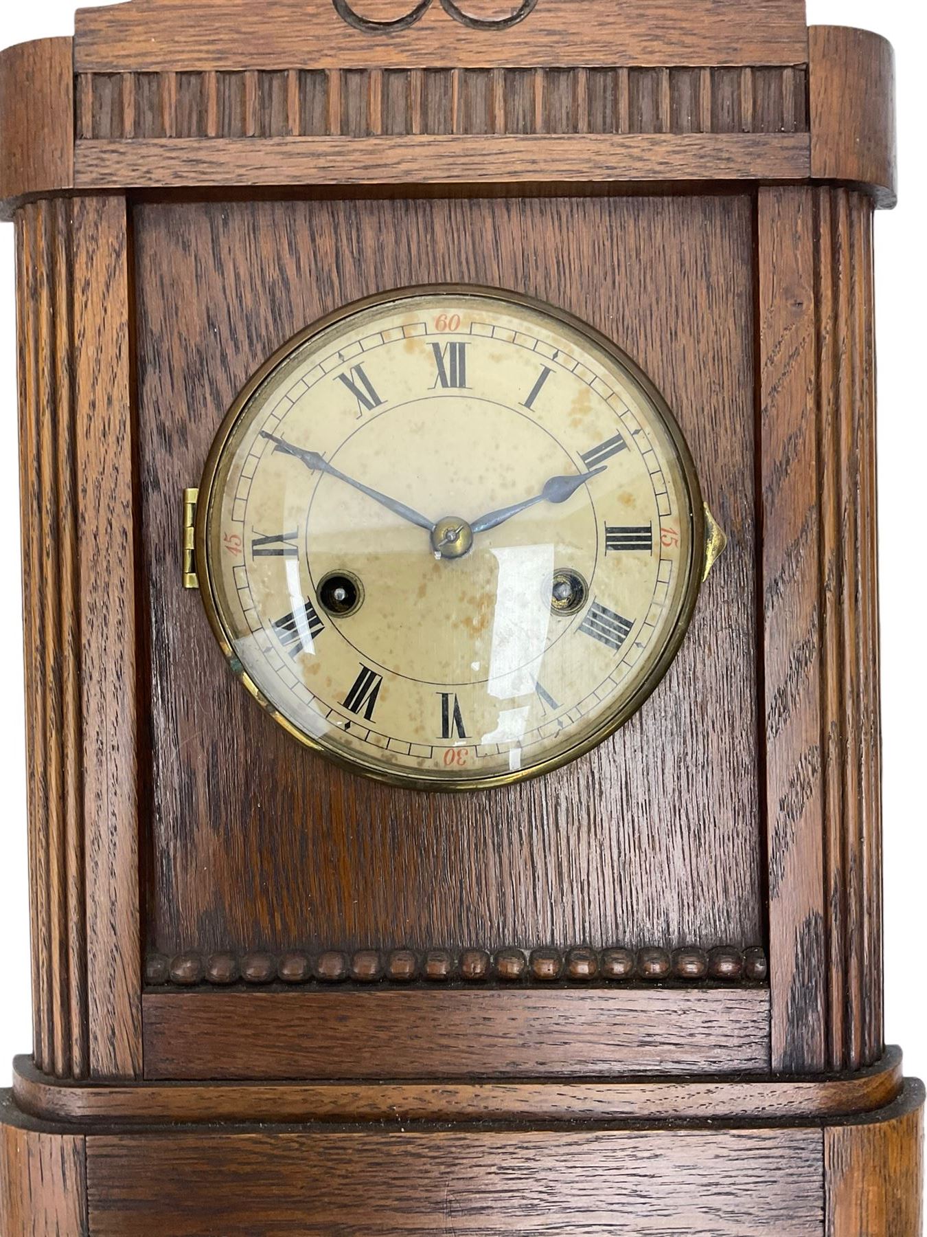 German striking mantle clock in an oak case by the Hamburg and American Clock company, with an 8-day spring driven movement, striking the hours on a coiled gong.