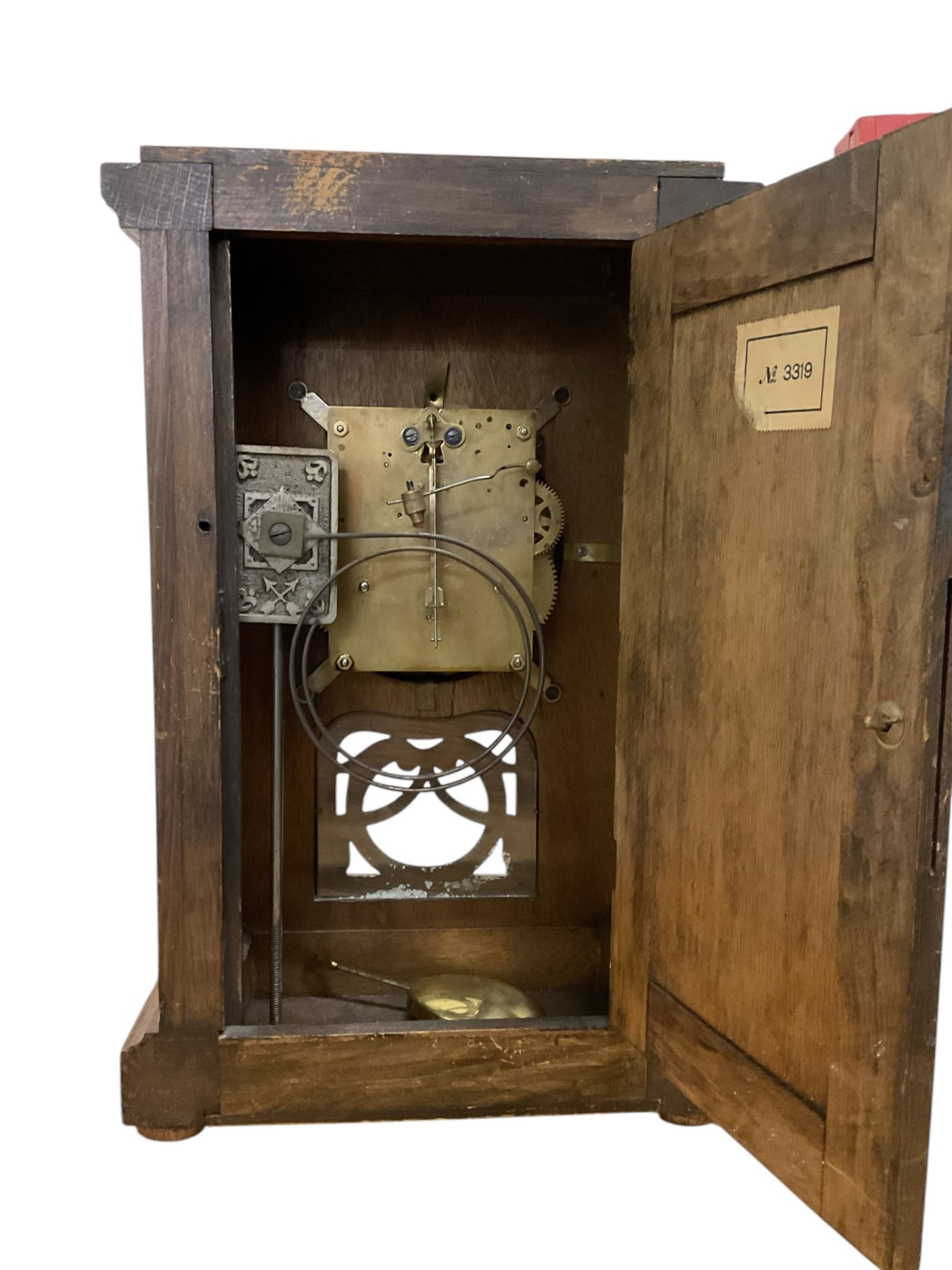 German-HAC oak cased 8-day mantle clock striking the hours on a gong. c1910. With key and pendulum.