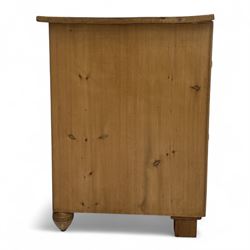 19th century pine chest of drawers, rectangular top over two short and two long drawers with oval pressed brass backplates and drop handles, panelled sides, rounded front edges, on compressed bun feet