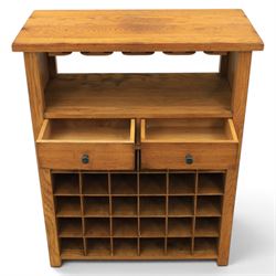 Traditional design light oak wine server, rectangular overhanging top above an open undertier with grooves for wine glasses, fitted with two drawers, lower section with open bottle racks for thirty five bottles, raised on square supports