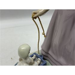 Four Lladro figures, comprising Pulling Dolls Carriage no 5044, Belinda with her Doll no 5045, Pretty Pickings no 5222 and Shepherdess with basket no 4678 