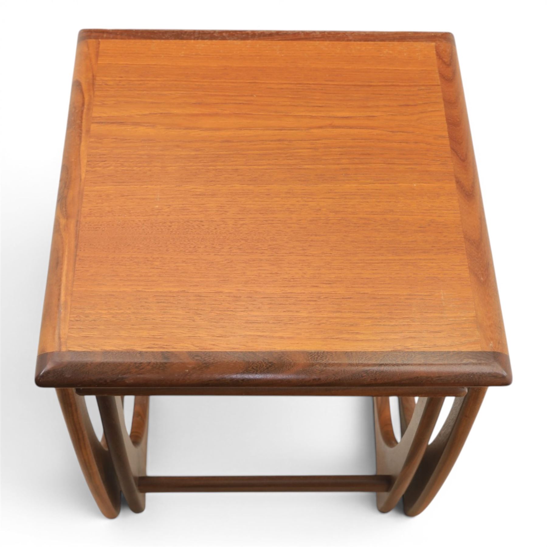 G-Plan - 'Astro' teak nest of three tables, square top with shaped supports