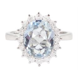 18ct white gold oval cut aquamarine and round brilliant cut diamond cluster ring, hallmarked, aquamarine approx 2.05 carat