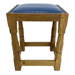 Brian Haw (former Mouseman carver) - Yorkshire oak stool, blue leather upholstered seat with stud band, on octagonal supports joined by plain stretchers