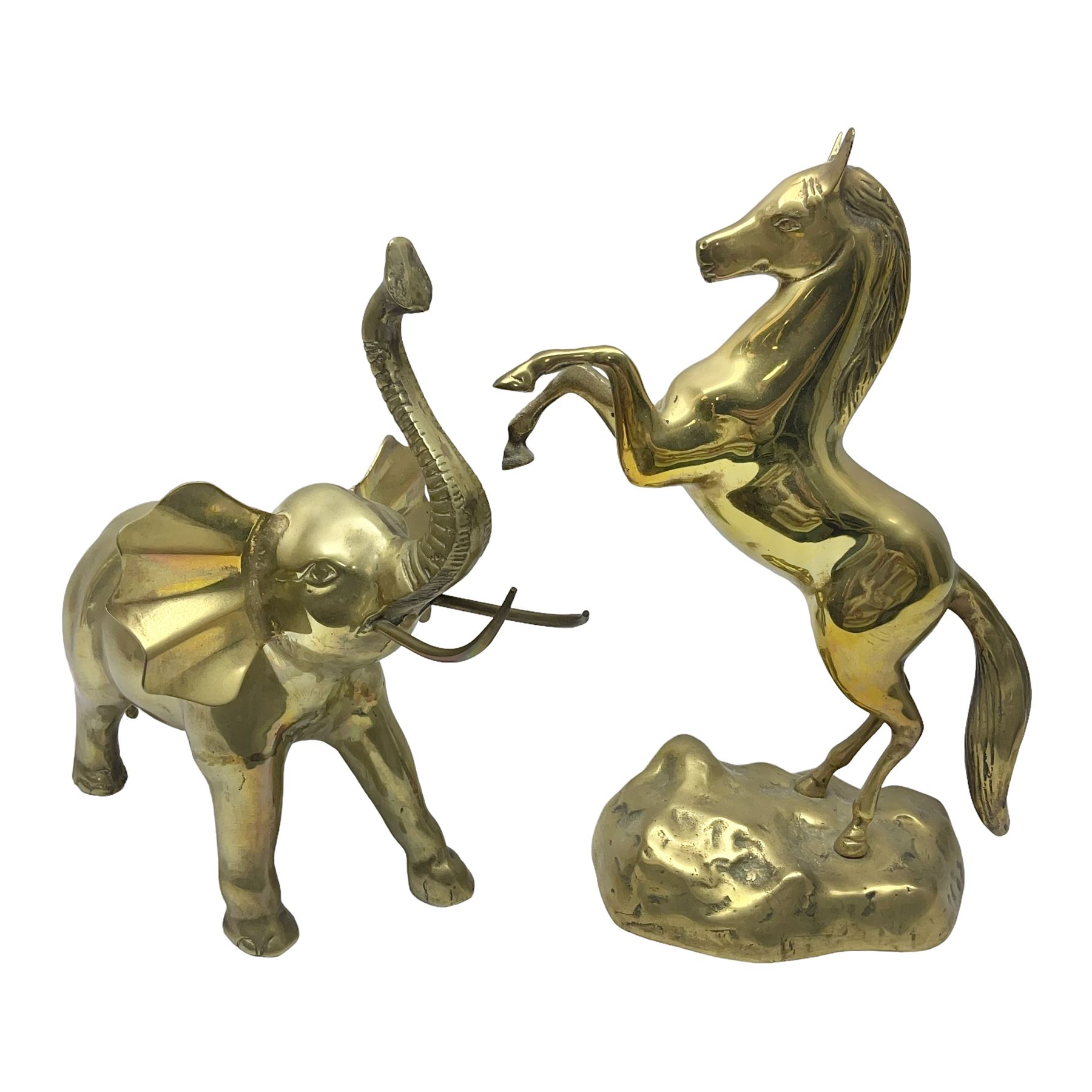 Two brass animals, the first example modelled as a rearing the horse and the other as an elephant, tallest H40cm