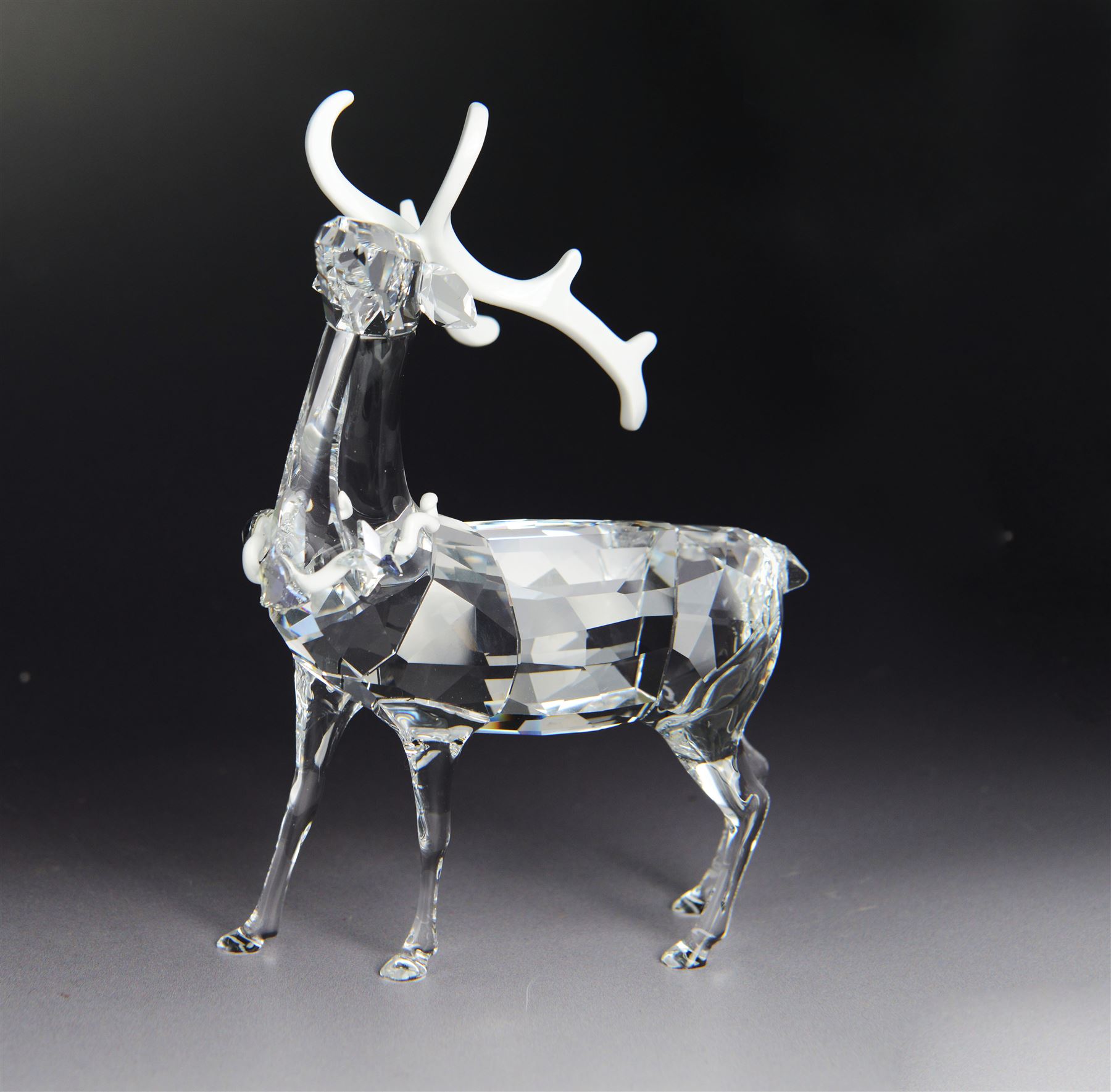 Two Swarovski figures, comprising Doe and Christmas Stag, both in original boxes 