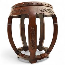 Pair of early 20th century Oriental hardwood barrel seats, of drum form with shaped apron and pierced panels, carved with stylised scrollwork and studded detail to the top