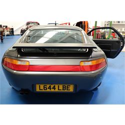 1991 Porsche 928 S4 Automatic Coupé

Registration: L644 LBE
Date of first registration as shown on V5: 1 July 1994
Porsche year of manufacture: 1991
Engine: 5.0-litre V8 petrol
Transmission: Automatic
Odometer reading: 37,886 kilometres (approximately 23,541 miles)
Colour: Slate Grey metallic
Interior: Black leather
V5C: Present
Keys: One
Chassis number: WP0ZZZ92ZMS800460

An exceptional Porsche 928 S4 Automatic Coupé finished in Slate Grey metallic with a black leather interior. The car displays a notably low odometer reading of just 37,886 kilometres, equivalent to approximately 23,541 miles.

The 928 S4 combined Porsche’s powerful 5.0-litre V8 engine with a sophisticated rear-mounted transaxle, creating a refined and accomplished grand tourer. This example is equipped with automatic transmission, electrically adjustable front seats, air conditioning, alloy wheels and the characteristic rear spoiler.

The car was purchased from Specialist Cars of Malton in June 2019, at which time the recorded mileage was 36,650 kilometres. The accompanying service record includes evidence of a cam belt replacement.

Presented in excellent condition throughout, the bodywork and metallic paint finish appear particularly well preserved, while the cabin retains its original character with black leather upholstery and 928-branded sill trims. A Japanese Porsche service label records maintenance entries at 31,902, 33,397 and 34,134 kilometres.

The car also features a Porsche Classic Communications Management (PCCM) upgrade system.

Features

• 5.0-litre V8 petrol engine
• Automatic transmission
• Slate Grey metallic paintwork
• Black leather interior
• Electrically adjustable front seats
• Air conditioning
• Porsche alloy wheels
• Rear spoiler
• Right-hand drive
• Odometer reading of 37,886 kilometres, approximately 23,541 miles
• Purchased from Specialist Cars of Malton in June 2019
• Recorded at 36,650 kilometres when purchased
• Service record showing cam belt replacement
• Japanese Porsche service label
• V5C present
• One key

This vehicle forms part of the Estate of the Late John Sils and is offered for sale by the Executors, confirming a genuine reason for sale.