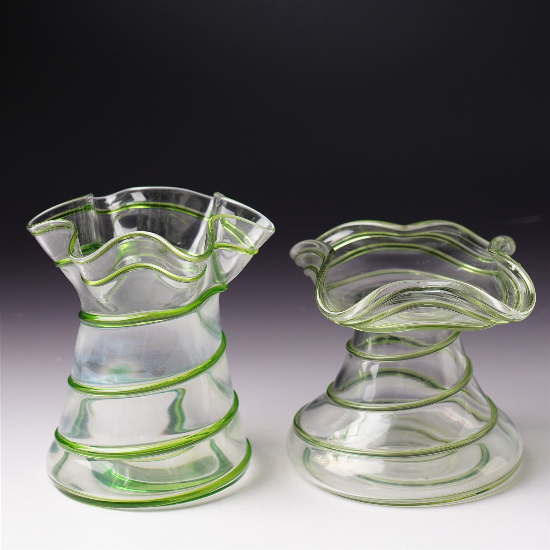 Three early 20th century glass vases, attributed to Stuart and Sons of Stourbridge, each with green glass art nouveau spiral decoration, largest H18cm (3)