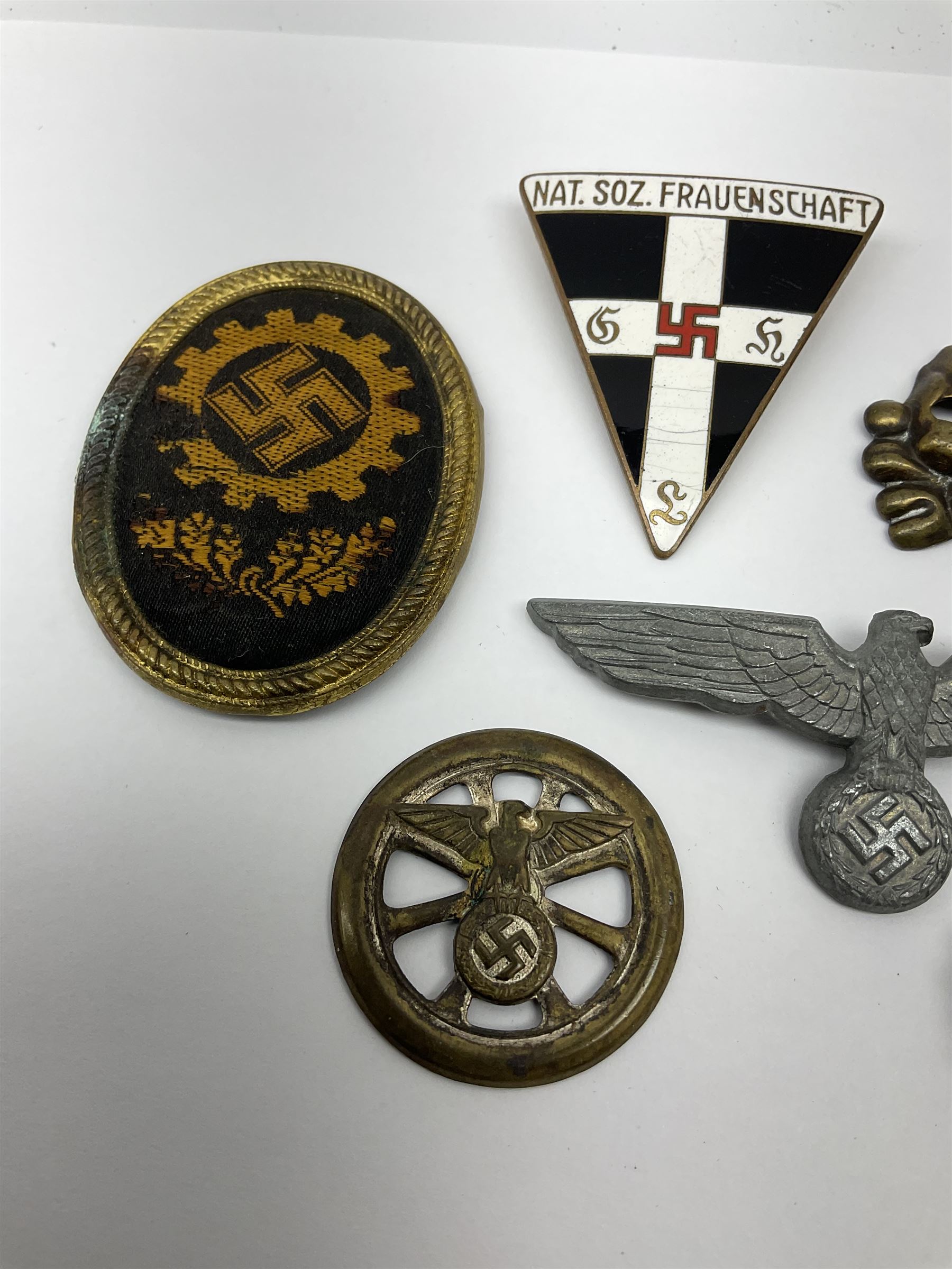 Six WW2 German badges - cap badge D.A.F. labour front; SS skull cap insignia First pattern 1925-35; Frauenschen Mother's Union; tank driver collar badge 1939-42; N.S.K.K. cycle corps; and officer's cap insignia 1940-42 (6)