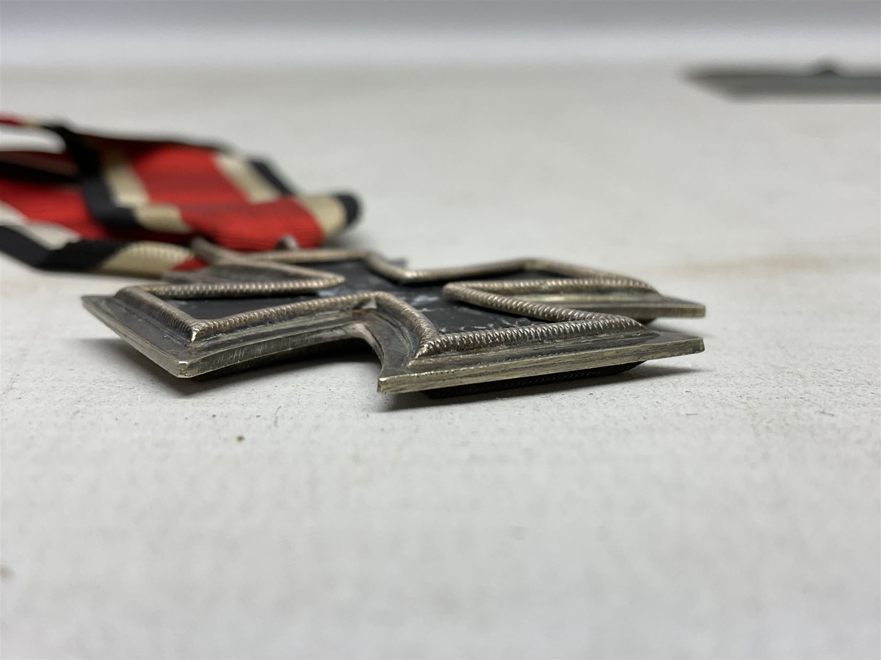 WW2 German Iron Cross 2nd Class with ribbon, ring stamped 44; and original issue packet; together with a copy of a WW2 Iron Cross