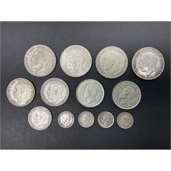 Approximately 110 grams of Great British pre 1947 silver coins, including halfcrowns, florins or two shillings, shilling and threepence pieces