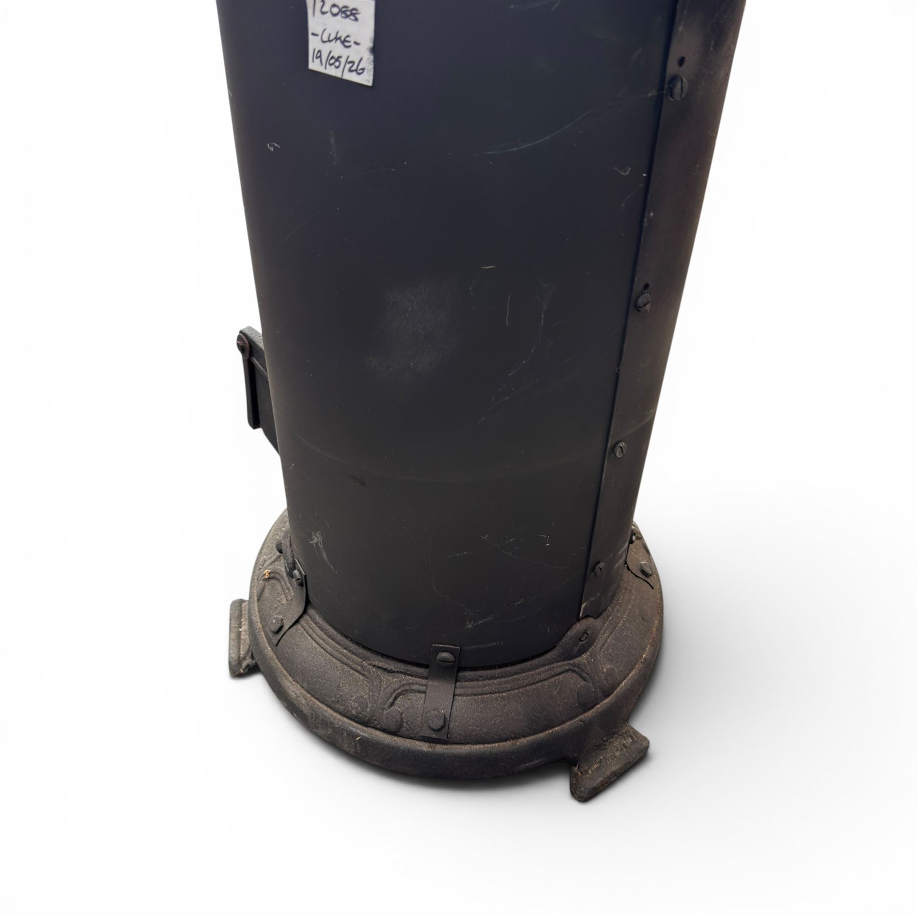 Late Victorian cast iron stove of small proportions, decorated with scrolls and central rosette to the top