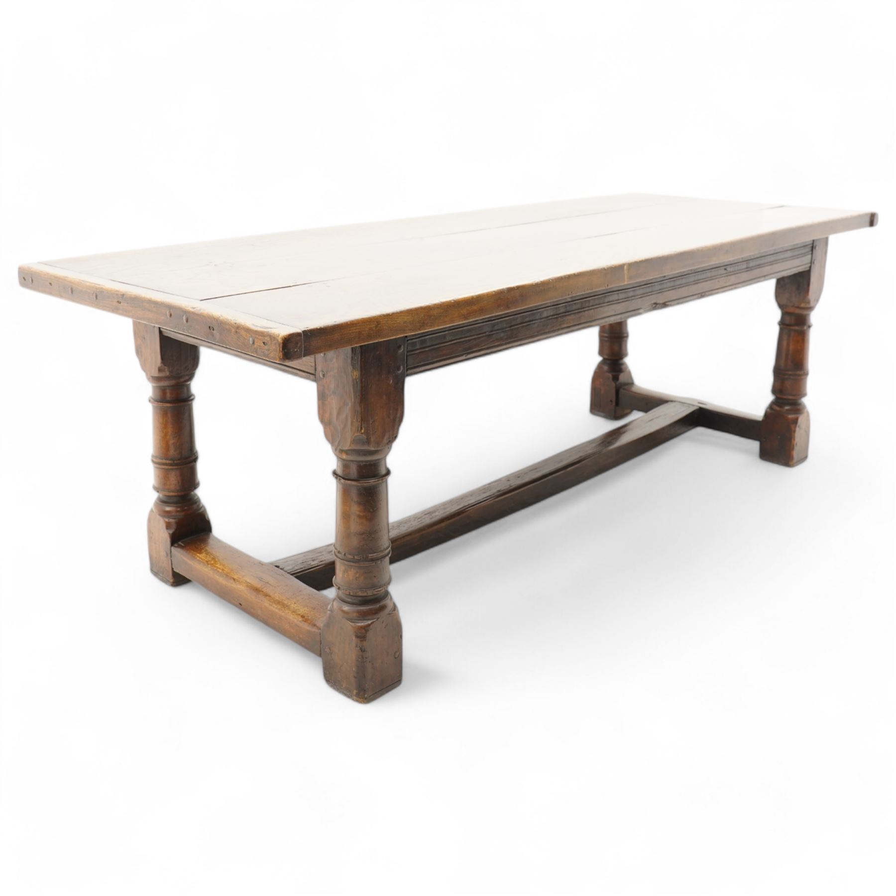 Jacobean design elm and oak refectory dining table, rectangular three plank top with cleated ends, moulded frieze rails on turned supports united by moulded stretcher rail