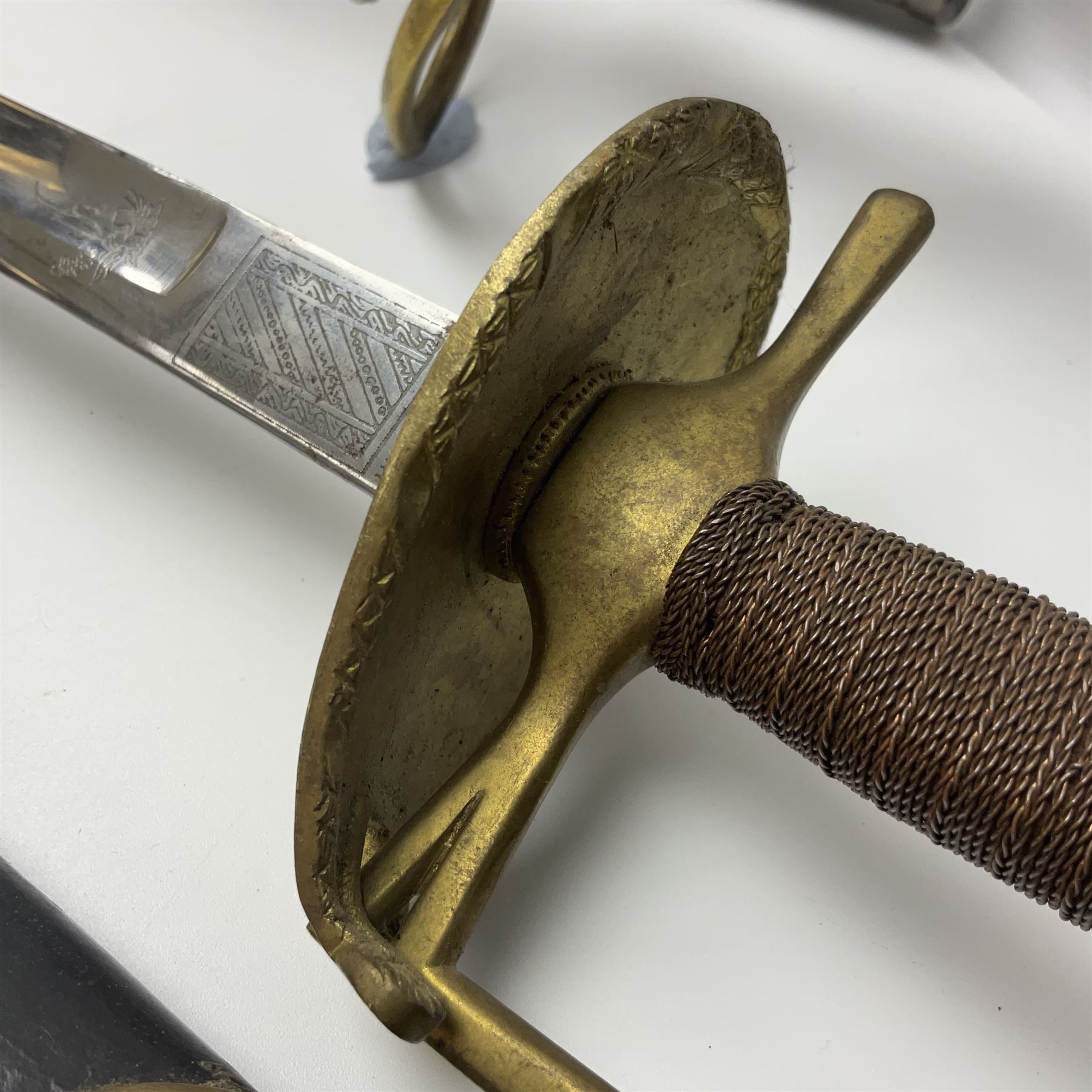 Reproduction American Civil War Cavalry trooper's sword, the 88cm slightly curving fullered steel blade marked to the ricasso 'Ames & Co Chicopee Mass.' and 'US ADK 1862'; brass hilt and leather covered grip; in steel scabbard; and Indian reproduction 19th century French court sword (2)