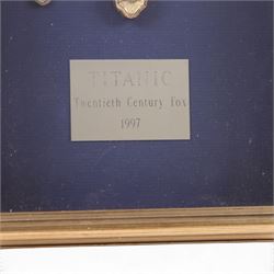 Titanic (Twentieth Century Fox 1997): framed set of cutlery used in the first class dining rooms scenes during the filming of the movie, sold by the J. Peterman Company, with original receipt and box
