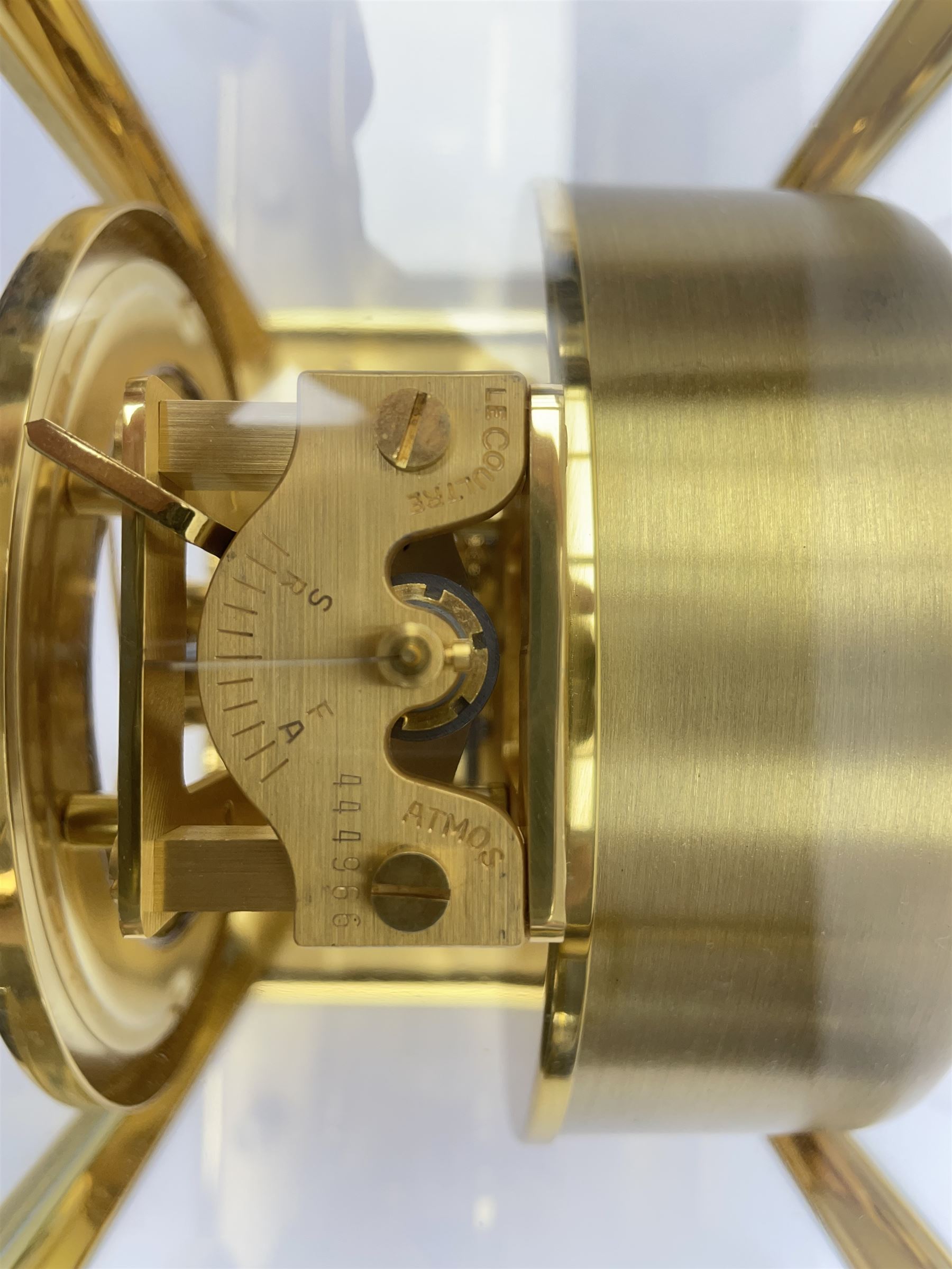 Jaeger-LeCoultre Atmos timepiece clock, in gilt brass and glass case, with wall mount, serial number - 444966