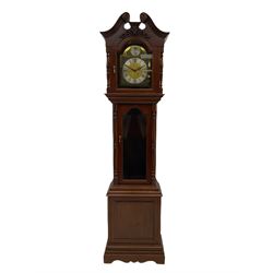A 20th century three train longcase clock in a mahogany finished case with a swan neck pediment in the Georgian style, with a fully glazed door, brass dial with silver chapter ring, spandrels and “Tempus Fugit” boss to the arch, chiming the hours on gong rods,
With pendulum and three weights.


.
