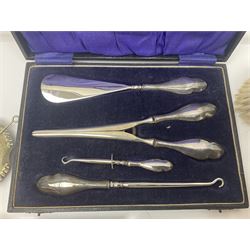Silver handled four piece manicure set, in fitted case, two silver mounted dressing table brushes, a Georgian silver mounted cut glass preserve jar and cover and a silver helmet shaped jug, costume jewellery including earrings, bracelets etc