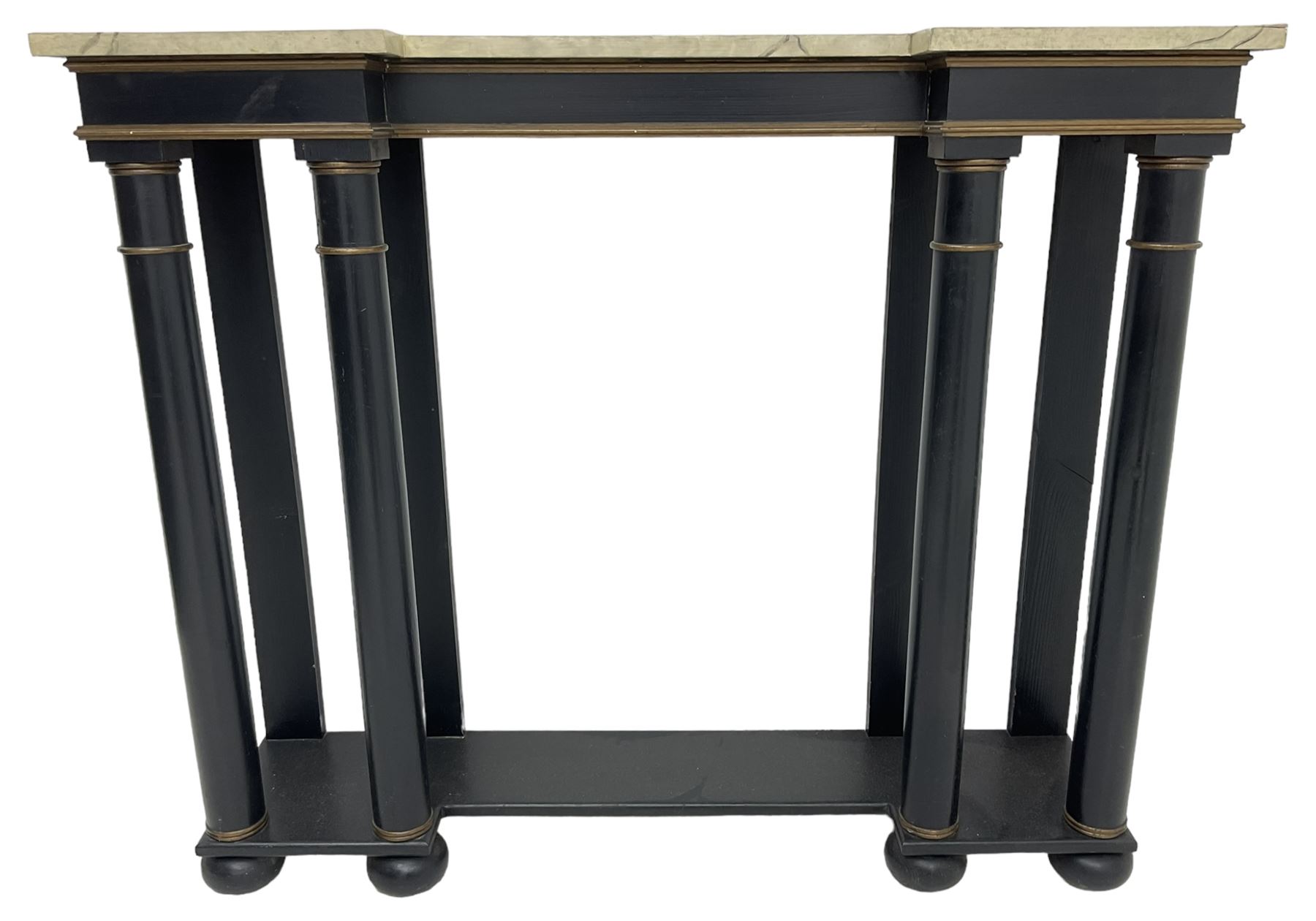 Italian design ebonised reverse-breakfront console table, painted simulated marble top over ebonised pilasters with gilt piping, platform base on compressed bun feet