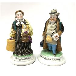 A pair of Victorian figural table vesta and match strikers, modelled as a man and woman, entitled I Am Starting For A Long Journey, and I'm Off With Him. 