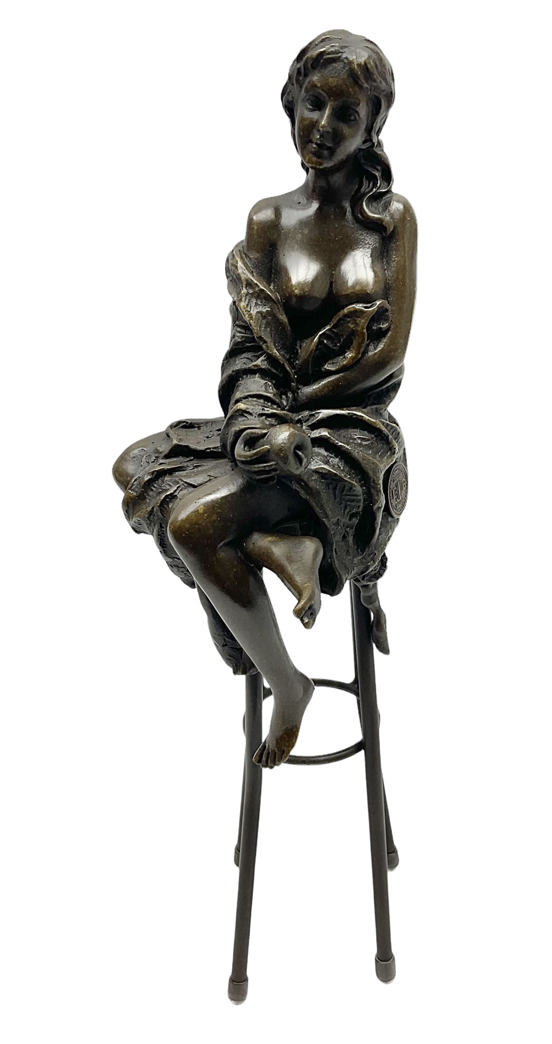 Art Deco style bronze modelled as a female figure seated upon a chair holding an apple, after 'Pierre Collinet', H28cm