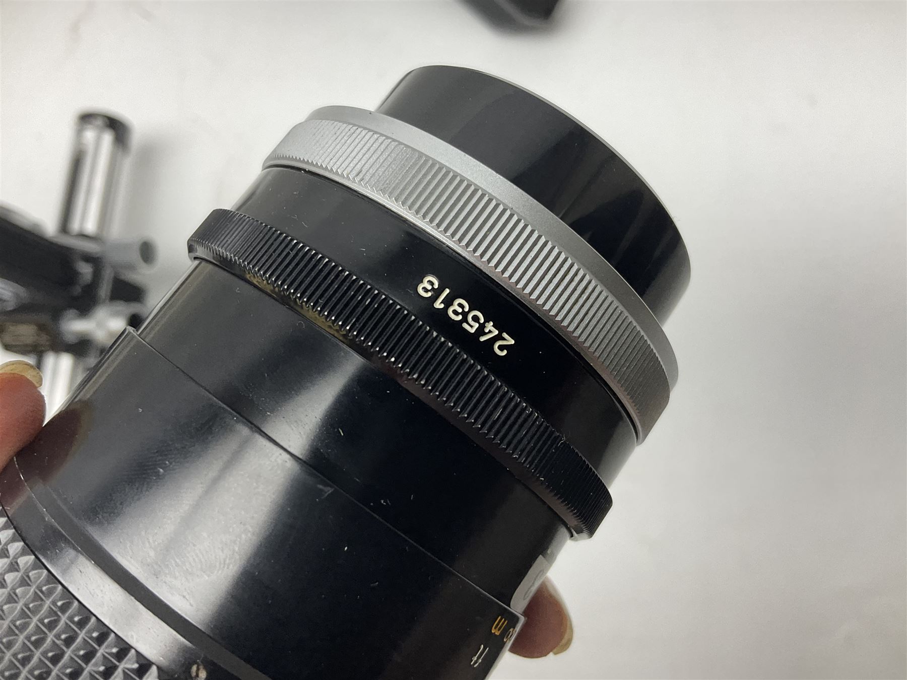 Collection of Canon lenses, to include 'Canon Lens FD 100mm 1:2.8', serial no 12821, 'Canon Lens FD 200mm 1:4' serial no 245313, 'Macro Canon Lens FL 50mm 1:3.5', serial no. 25505, 'Canon Lens FD 135mm 1:3.5 etc, together with other Canon equipment, including Bellows FL, Slide Duplicator etc 