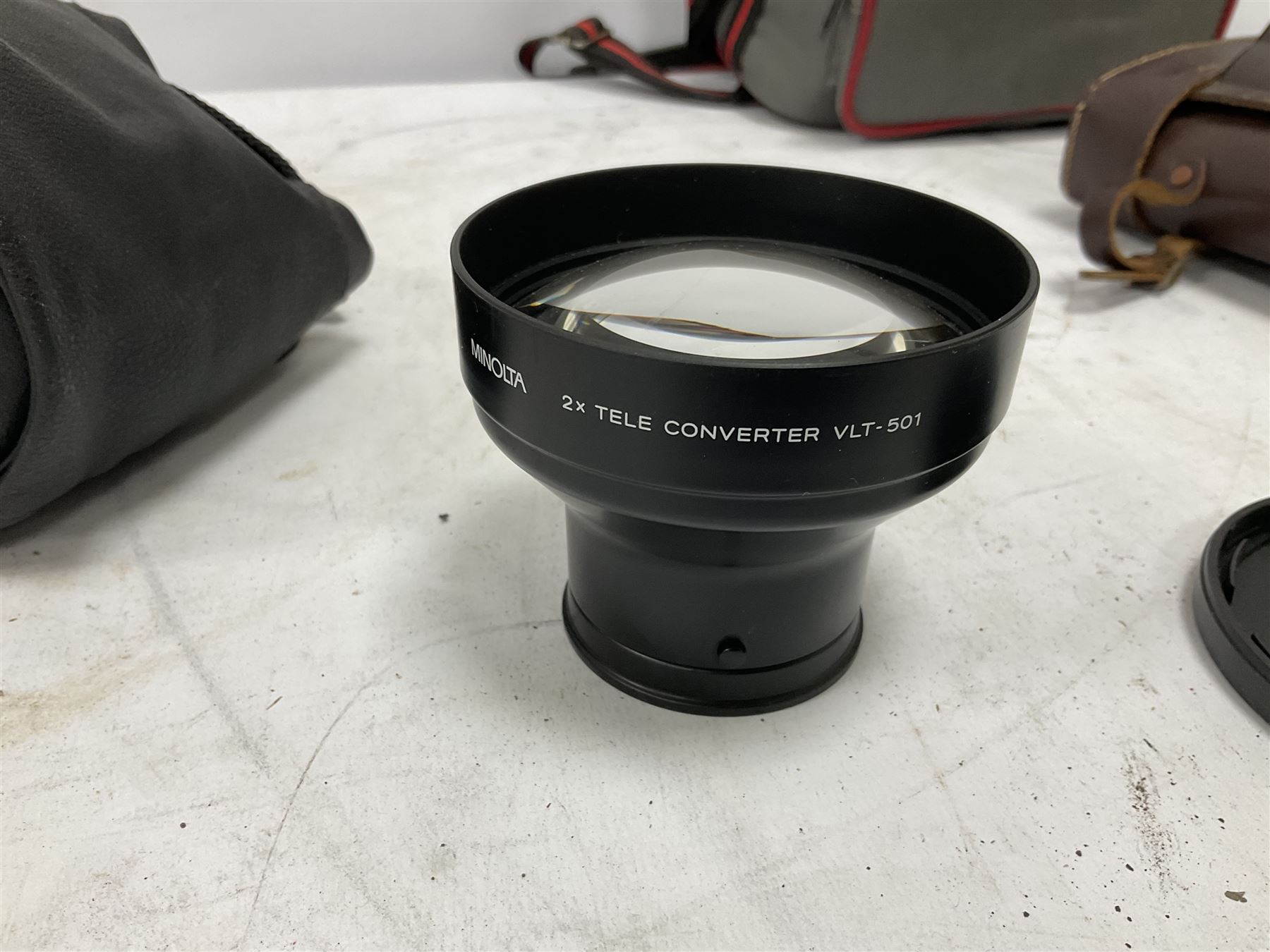 Quantity of cameras and accessories to include Olympus Trip 35, Minolta A f-EII 35mm, Yashica Auto Focus camera, Hanimex 35mm af camera in case, Kodak No.2A Folding Pocket Brownie camera in case, Minolta VLT-501 lens, etc