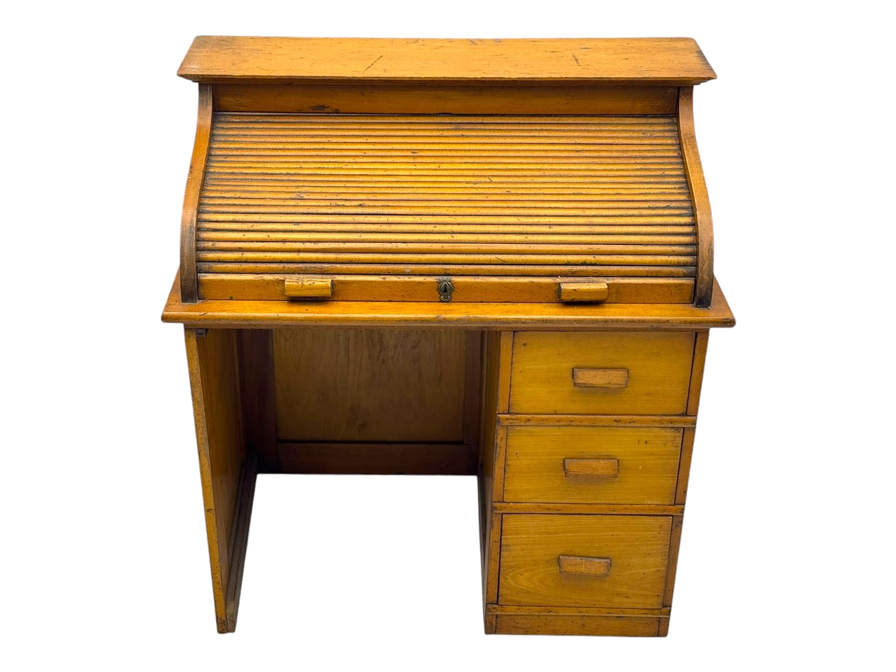 Leeway - late 19th century light oak child's roll-top desk, tambour top opening to reveal fitted interior with green felt writing surface and five pigeonholes, over three graduated drawers on the right side, raised on panelled side supports