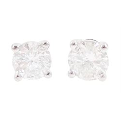 Pair of 18ct white gold round brilliant cut diamond stud earrings, stamped, total diamond weight approx 0.80 carat
