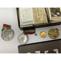 Quantity of cigarette cards and silks, some housed in albums, together with commemorative medallions etc