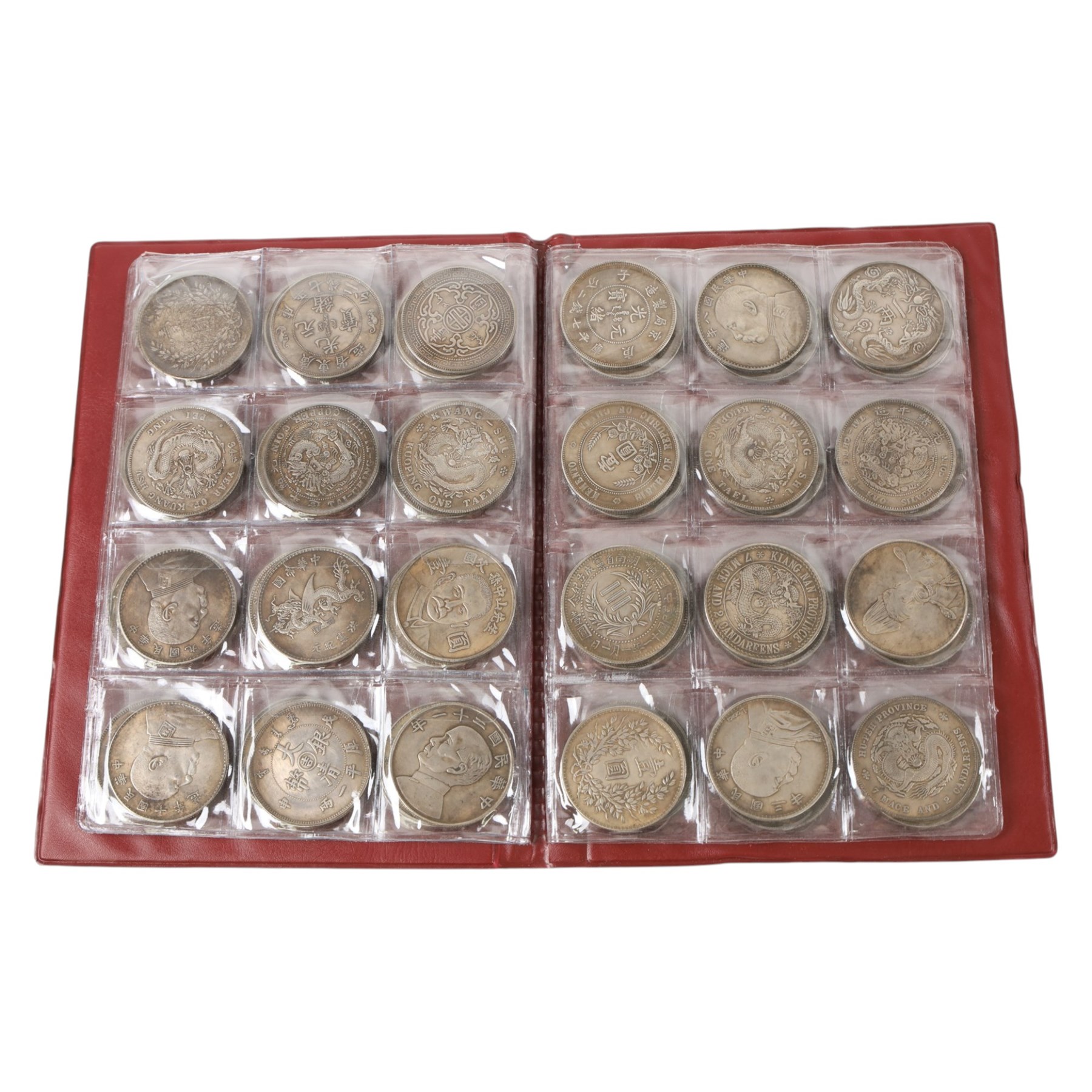 Seventy-two restrike Chinese coins, in a red album