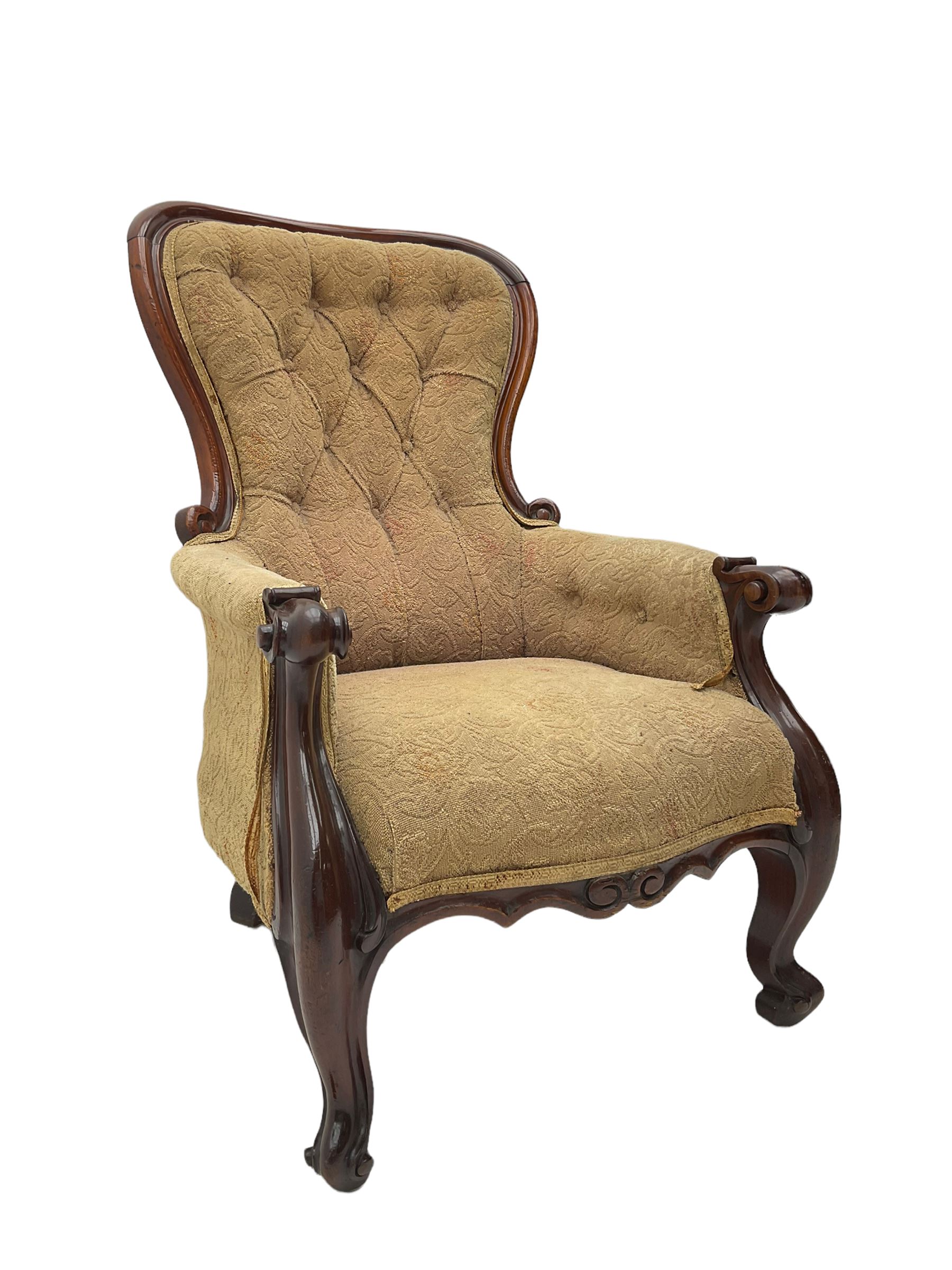 Victorian mahogany upholstered armchair, moulded framed, scroll carved arm terminals on scrolled cabriole supports, shaped carved apron