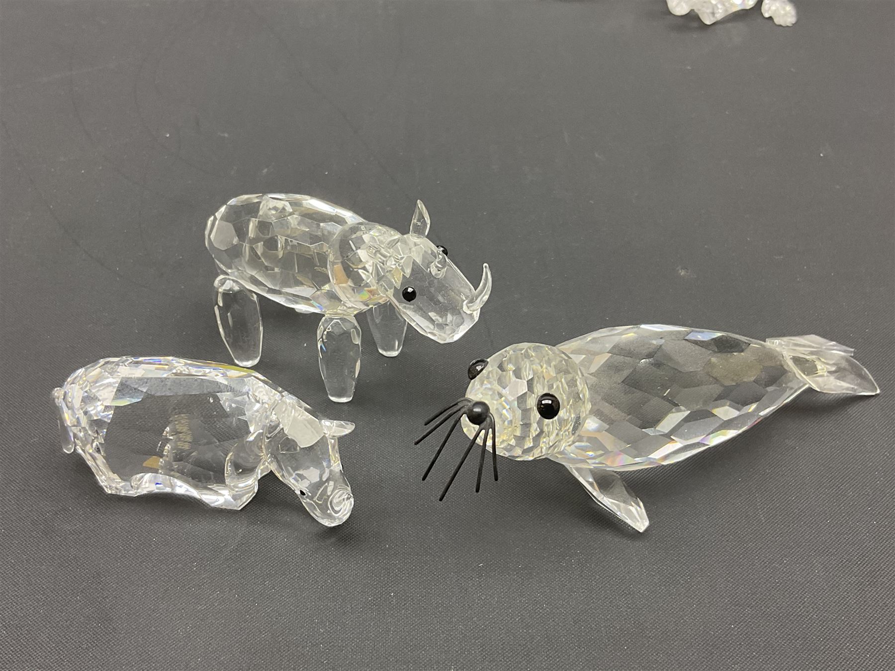 Twenty nine Swarovski Crystal animals, to include koala and baby, in frosted tree branch, elephants, polar bears, squirrel, monkeys, panda, unicorn and snails, etc 