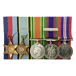 Group of five medals comprising 1939-1945 War Medal, Defence Medal, 1939-1945 Star, Air Crew Europe Star and Canadian Volunteer Service Medal with maple leaf clasp; all with ribbons and mounted on a display board