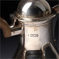 Four piece silver tea and coffee service of baluster form, the tea and coffee pots with domed covers and stained handles London 1916-1918, Maker  C S Harris & Sons Ltd