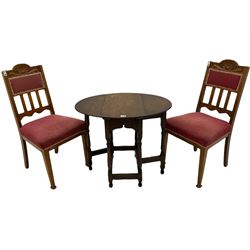 Pair early 20th century oak chairs with upholstered seats and an oak drop leaf table on spindle turned supports