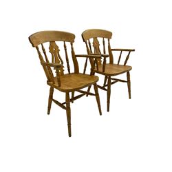 Pair beech farmhouse style elbow chairs, bar back over pierced fiddle splat and turned spindles, on turned supports joined by stretchers
