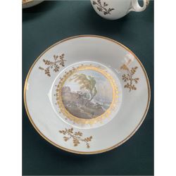 19th century teacup and saucer, possibly Coalport, decorated with panels of flowers on a cobalt blue ground with gilt decoration; together with two other teacup and saucer pairs, one with hand painted landscape decoration 