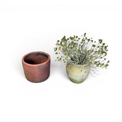 Large terracotta circular planter, oval form with ribbed top, planted; and an Errington Reay & Sons terracotta planter