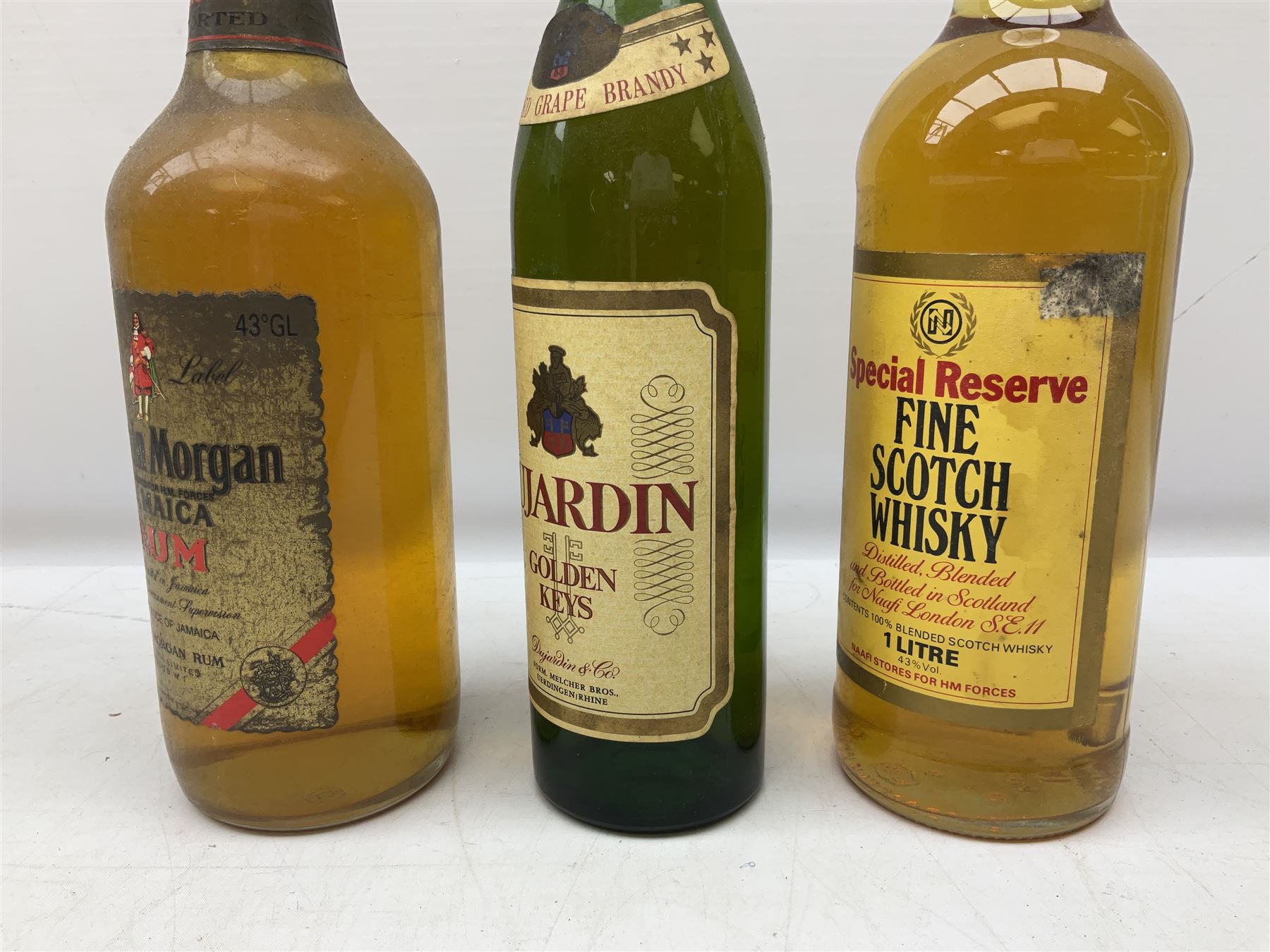 Mixed alcohol including, Carte Noire Cellien des Dauphins 1990 red wine, 75cl 13.5% vol, Dujardin Golden Keys blended grape brandy, contents and unknown proof, Special Reserve fine Scotch whisky, 1l, 43% vol and two others of various contents and proof 