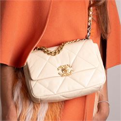 Chanel - ‘19’ Medium Flap Bag, the model introduced in 2019 as one of the final designs associated with Karl Lagerfeld, in cream quilted lambskin leather with mixed gold, silver and ruthenium-tone chain strap and signature CC monogram turn-lock fastening, unused with original dust bag and box