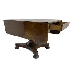 Early 19th century figured mahogany supper table, rounded rectangular drop leaf top with moulded edge, fitted with drawer to each end, turned pedestal on shaped platform, lobe carved compressed bun feet with recessed castors 