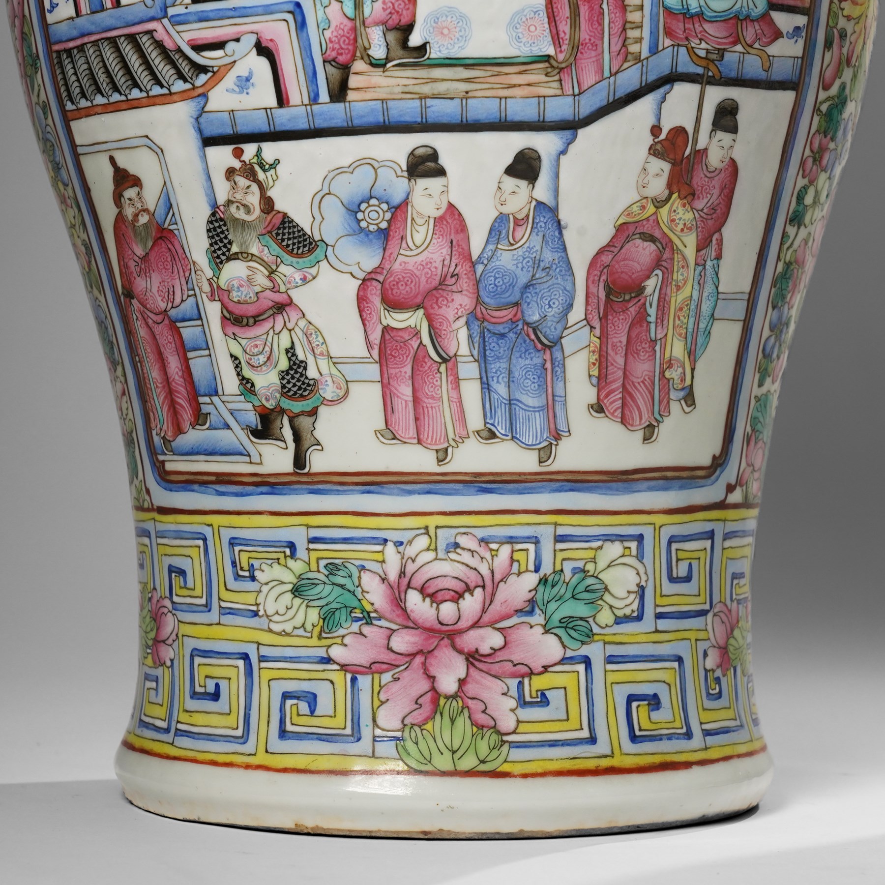 Large pair of 19th century Cantonese famille rose vases, each painted with various courtly scenes, including a display of warriors fighting on horseback before an official and his attendants, double Buddhist lion handles and applied at the shoulders with chilong, the lower band painted with Greek key motif, H58cm (2)