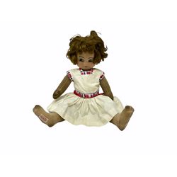 1920s Chad Valley 'Bambina' doll, the pressed felt head with applied hair, side glancing inset glass eyes, painted facial features and velvet jointed body, Hygenic and Bambina labels to the feet H46cm