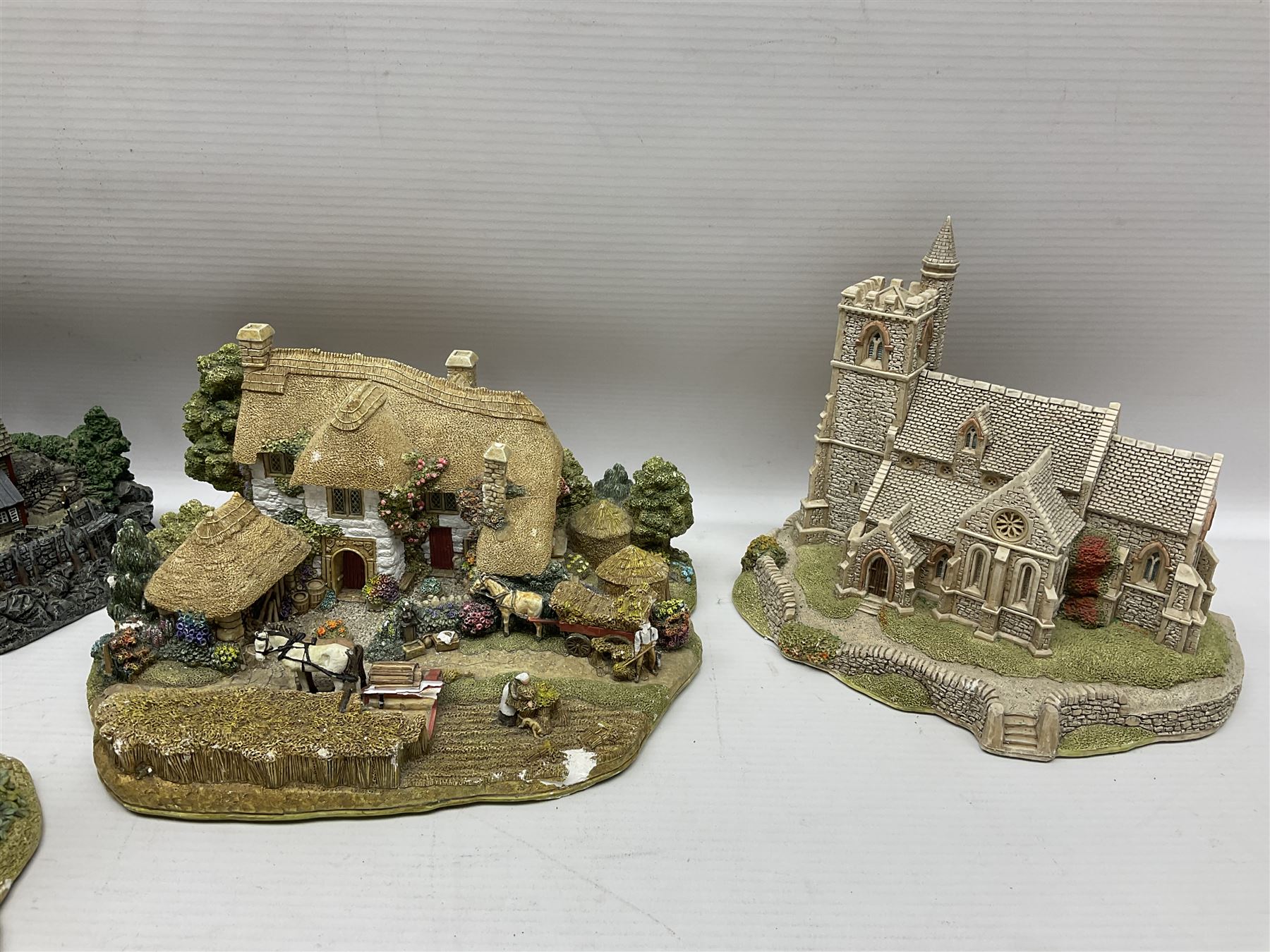 Twenty six Lilliput Lane models, to include Golden Harvest, Junk and Disorderley, Heaven Lea Cottage, Old Scrumpy Farm, Chantry Chapel Wakefield, etc, together with four similar cottages