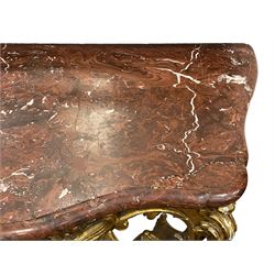 19th century giltwood and gesso console table, shaped variegated rouge marble top with moulded edge, central shell motif with extending scrolled foliage, on foliate and flower head moulded cabriole supports united by pierced shell middle rail, scrolled acanthus leaf terminals 