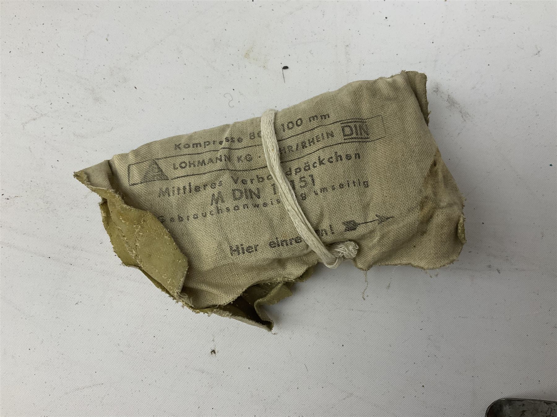 WW2 German 'SS' leather belt with six pouches (one containing unused field bandage) and buckle inscribed 'Meine Ehre Heifst Treue'; belt marked 0/0836 0029